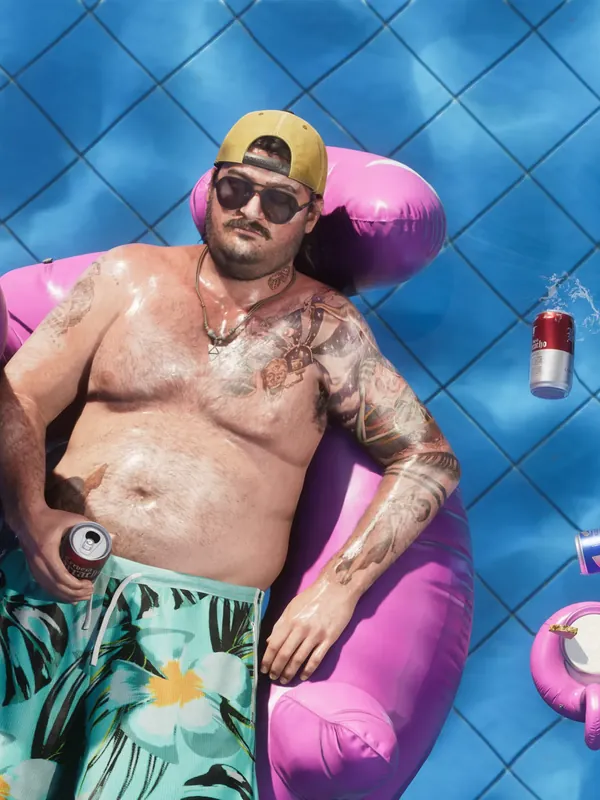 GTA 6 Cal Hampton lying on a flamingo float in a pool, official Rockstar Games artwork