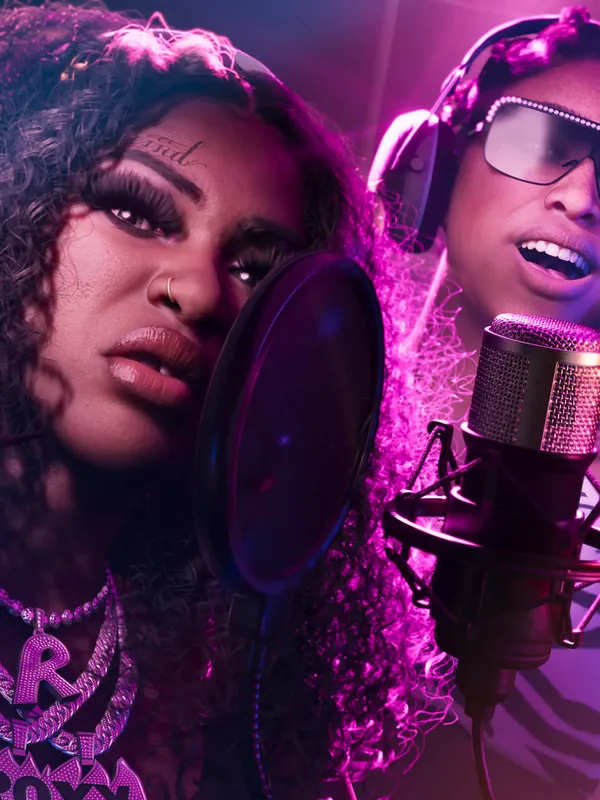 GTA 6 Real Dimez Bae-Luxe and Roxy recording in a studio, official Rockstar Games artwork