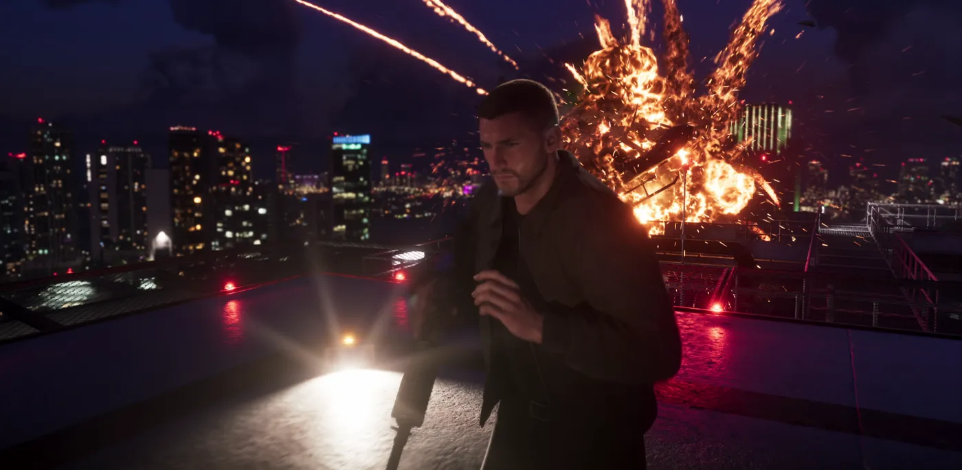 Short-haired Jason with an earpiece on a Vice City rooftop as a helicopter explodes in the GTA 6 launch trailer